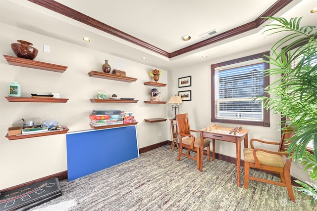 interior space featuring a tray ceiling and ornamental molding