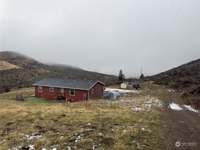 view of property exterior featuring a mountain view