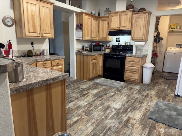 kitchen featuring washer / dryer, kitchen peninsula, dark hardwood / wood-style flooring, and black range with electric cooktop