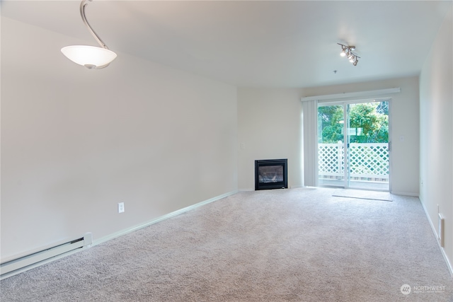 unfurnished living room with carpet and a baseboard radiator