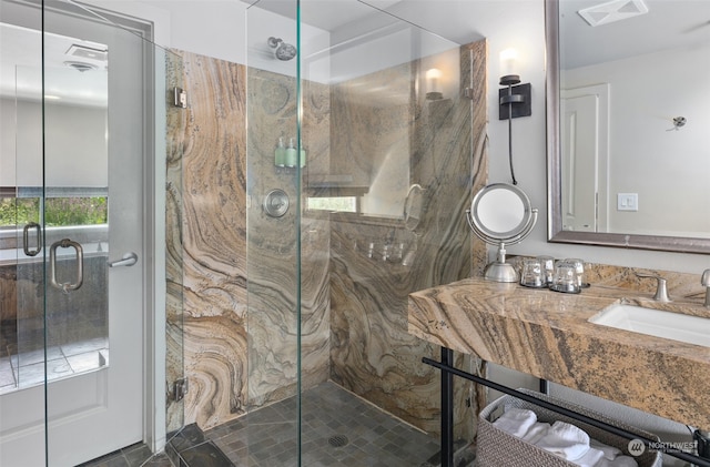 bathroom with vanity and an enclosed shower