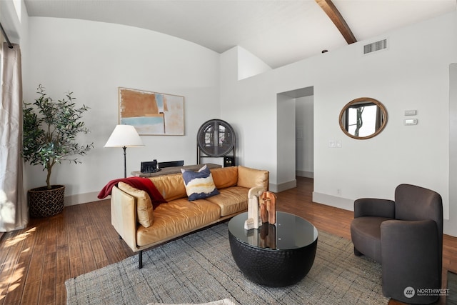 living room with lofted ceiling with beams and hardwood / wood-style flooring