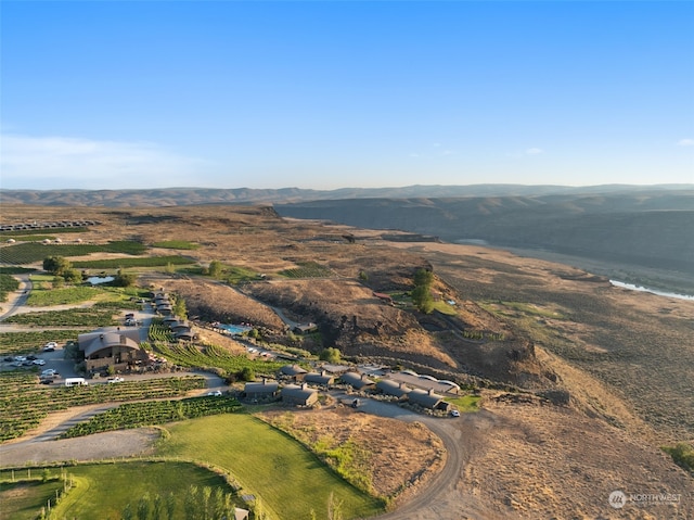 drone / aerial view with a water view and a rural view