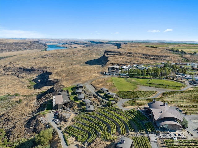 birds eye view of property with a water view and a rural view