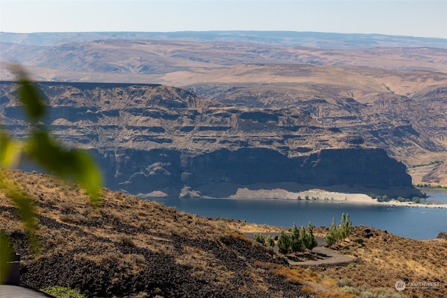 property view of mountains featuring a water view