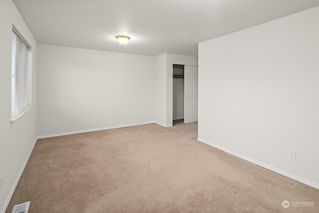 spare room with light colored carpet