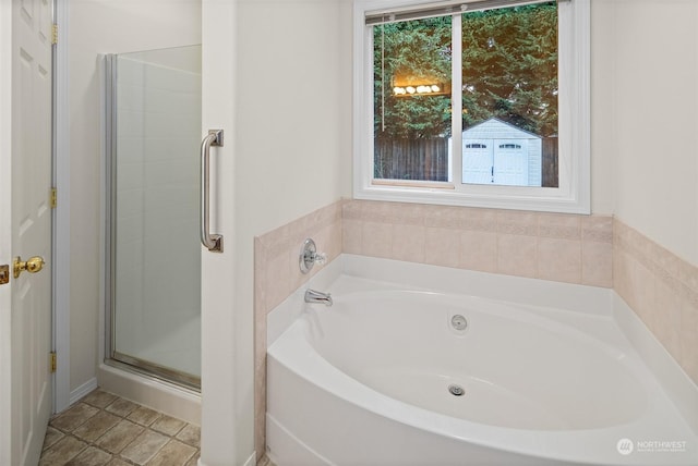 bathroom featuring independent shower and bath