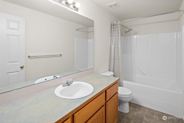 full bathroom featuring shower / bath combo, vanity, and toilet