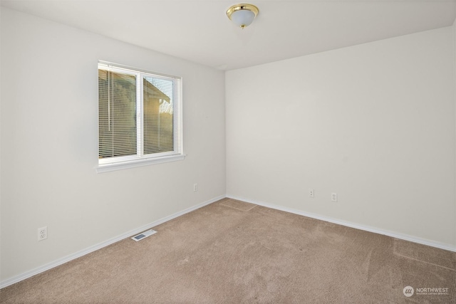 view of carpeted spare room