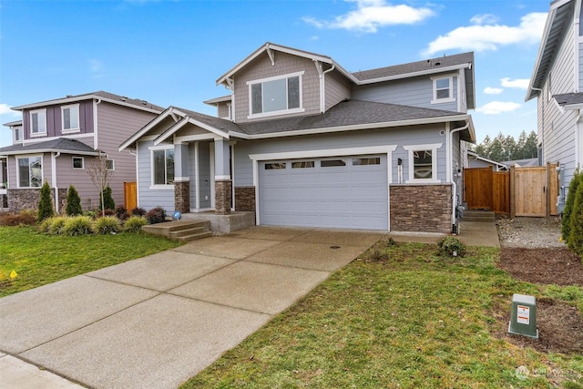 craftsman inspired home featuring a front lawn and a garage