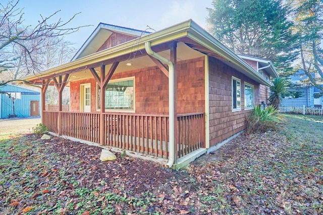 view of property exterior with a porch