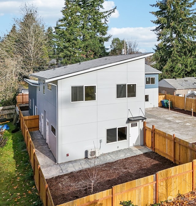 back of property with a patio