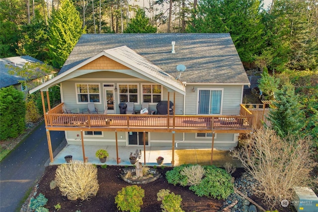 view of front of property with a deck and a patio