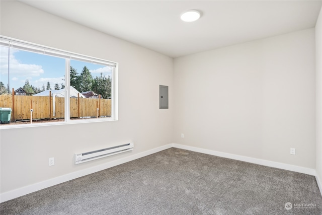 carpeted empty room featuring electric panel and a baseboard heating unit