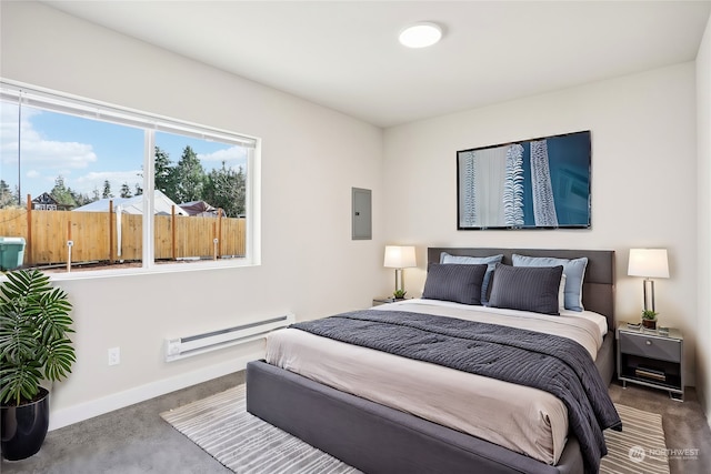 carpeted bedroom featuring electric panel and a baseboard radiator