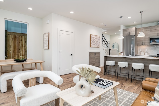 living room with light hardwood / wood-style flooring