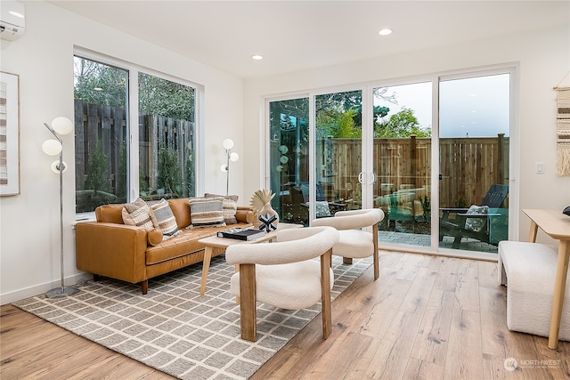 sunroom featuring an AC wall unit