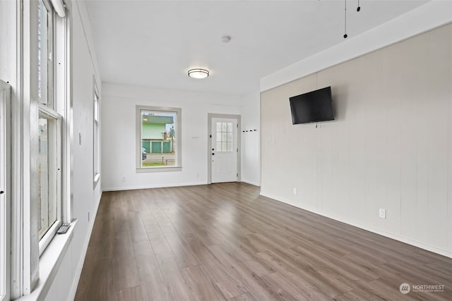 unfurnished living room with hardwood / wood-style floors