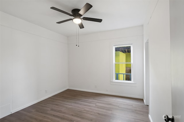 spare room with ceiling fan and hardwood / wood-style floors