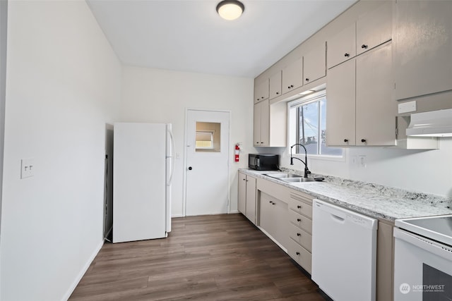 kitchen featuring exhaust hood, sink, dark hardwood / wood-style floors, and white appliances