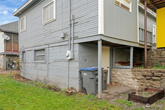 view of side of property with ac unit