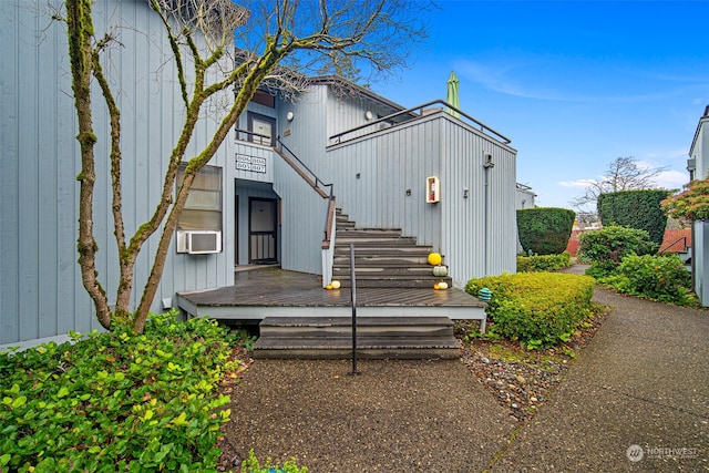 rear view of house featuring cooling unit