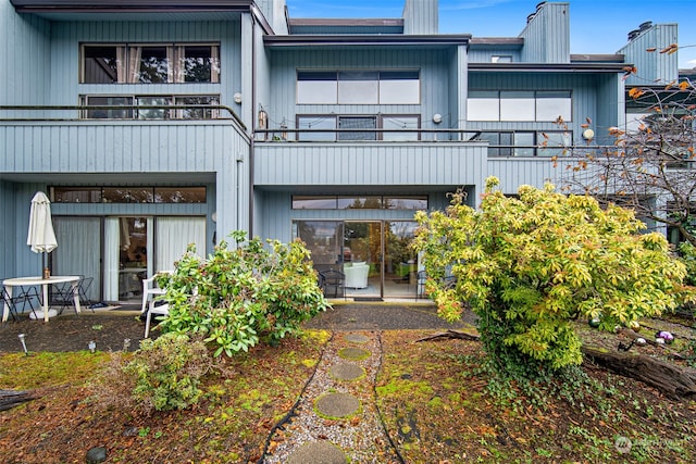 rear view of house featuring a balcony