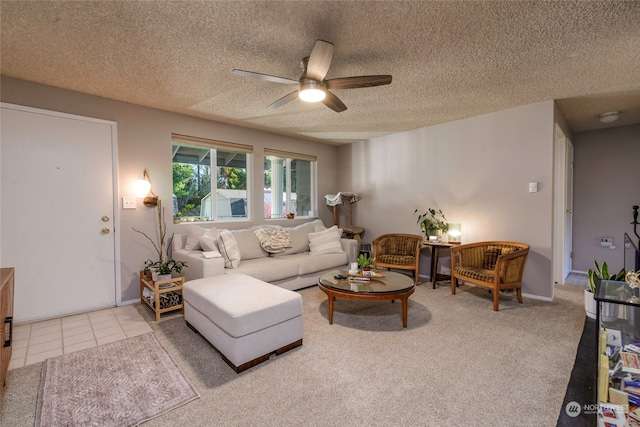 living room featuring carpet flooring, a textured ceiling, and ceiling fan