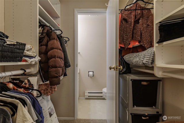 spacious closet with baseboard heating