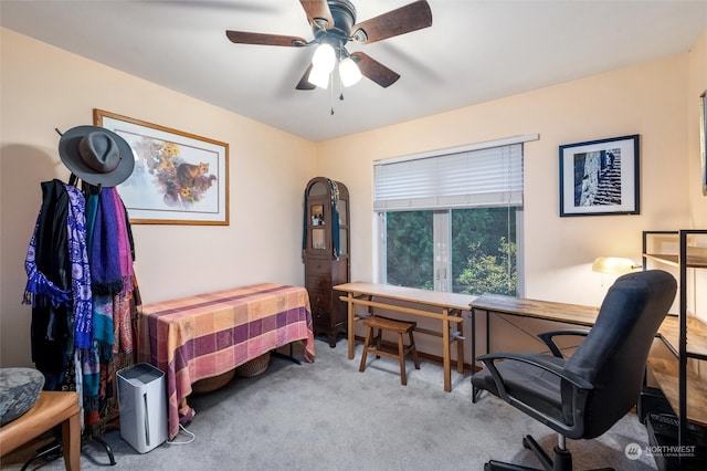 bedroom with ceiling fan and light carpet