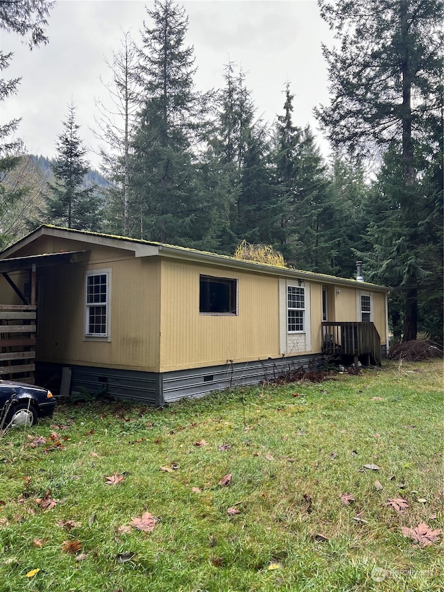 view of property exterior featuring a yard