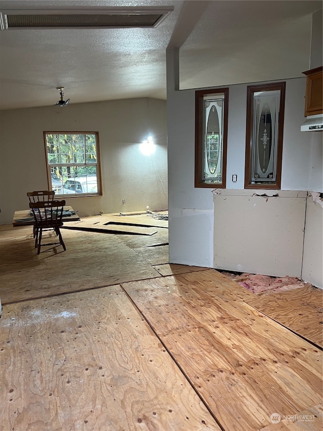 interior space with a textured ceiling