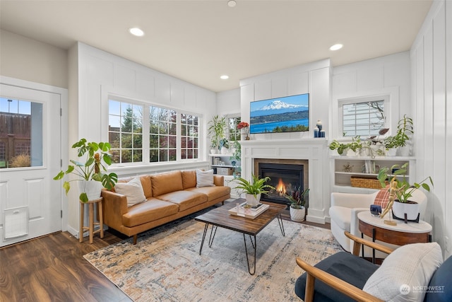 living room with dark hardwood / wood-style flooring