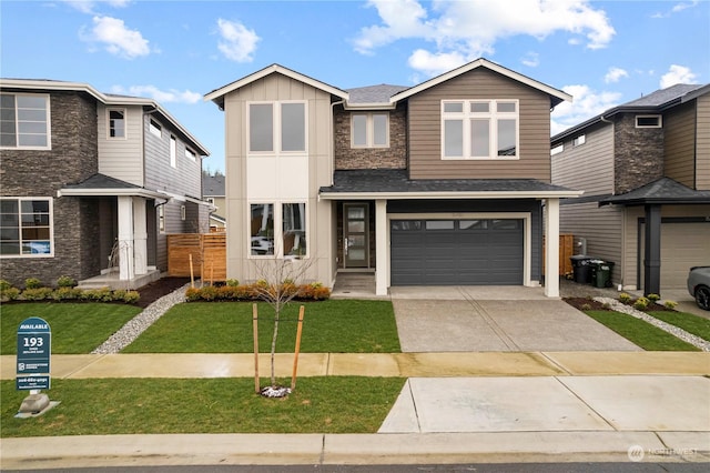 view of front of property with a garage and a front yard