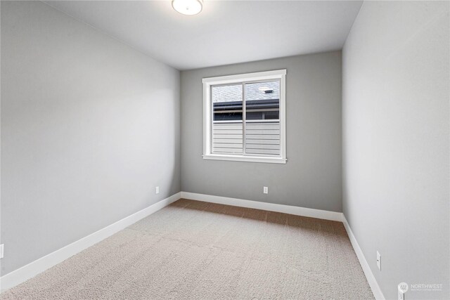 spare room featuring carpet floors