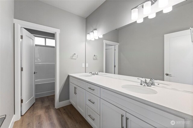 bathroom with vanity and hardwood / wood-style flooring