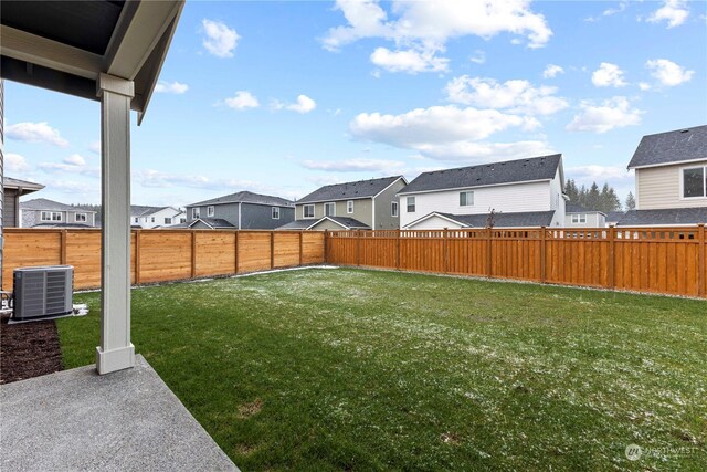 view of yard featuring a patio and central air condition unit