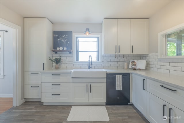 kitchen featuring dark hardwood / wood-style flooring, dishwasher, and white cabinets