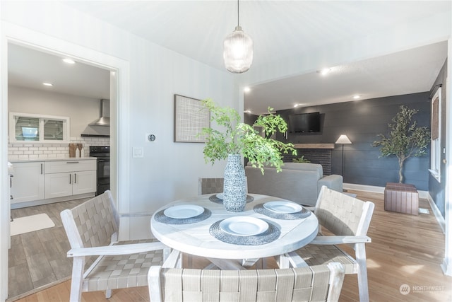 dining space with light wood-type flooring