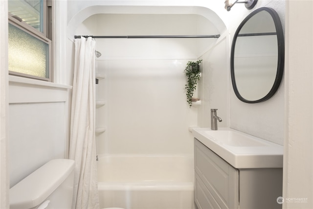 full bathroom featuring vanity, toilet, and shower / tub combo