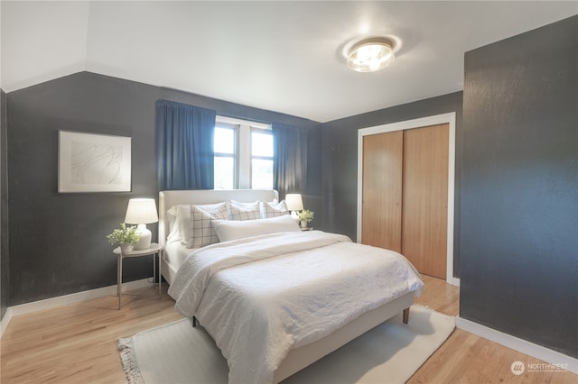 bedroom featuring a closet and light hardwood / wood-style floors