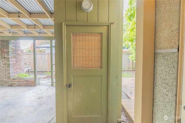 doorway to outside featuring concrete floors