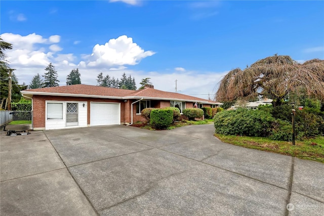 ranch-style house featuring a garage