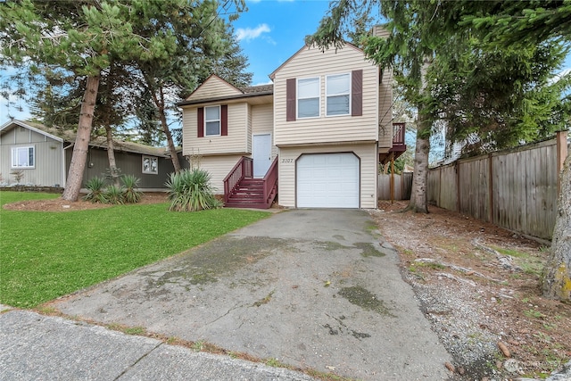 view of front facade with a garage and a front yard