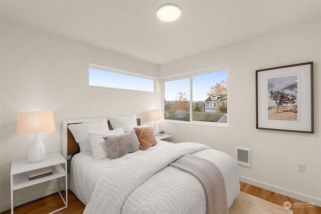 bedroom with wood-type flooring