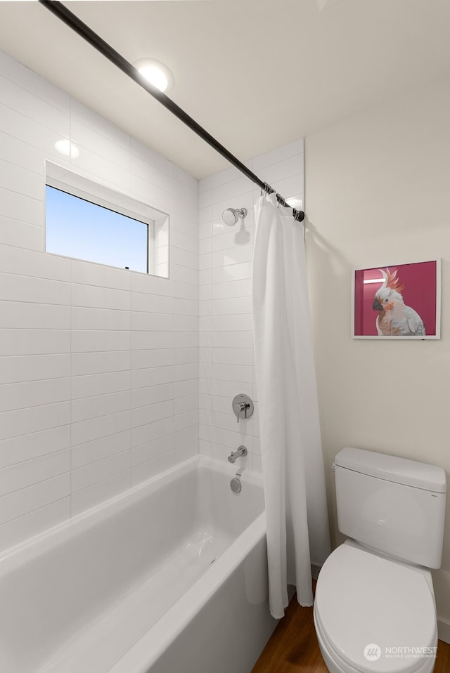 bathroom featuring toilet, shower / tub combo, and hardwood / wood-style flooring