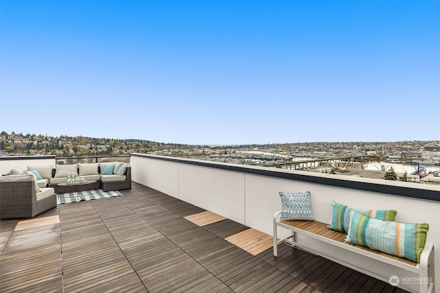 wooden terrace featuring an outdoor hangout area