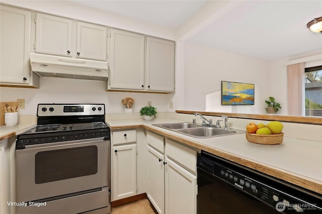 kitchen with under cabinet range hood, light countertops, and electric range