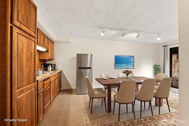 dining room featuring baseboards