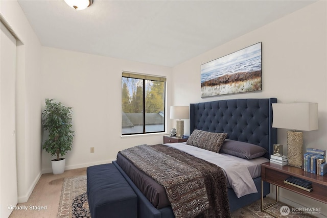 carpeted bedroom featuring baseboards